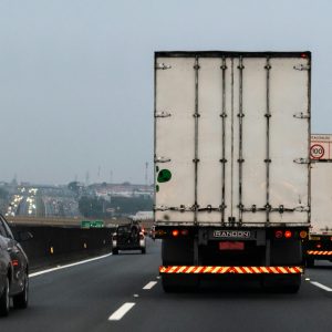 Rear view of a truck on a foggy highway in Sumaré, Brazil, showcasing logistics transportation.
